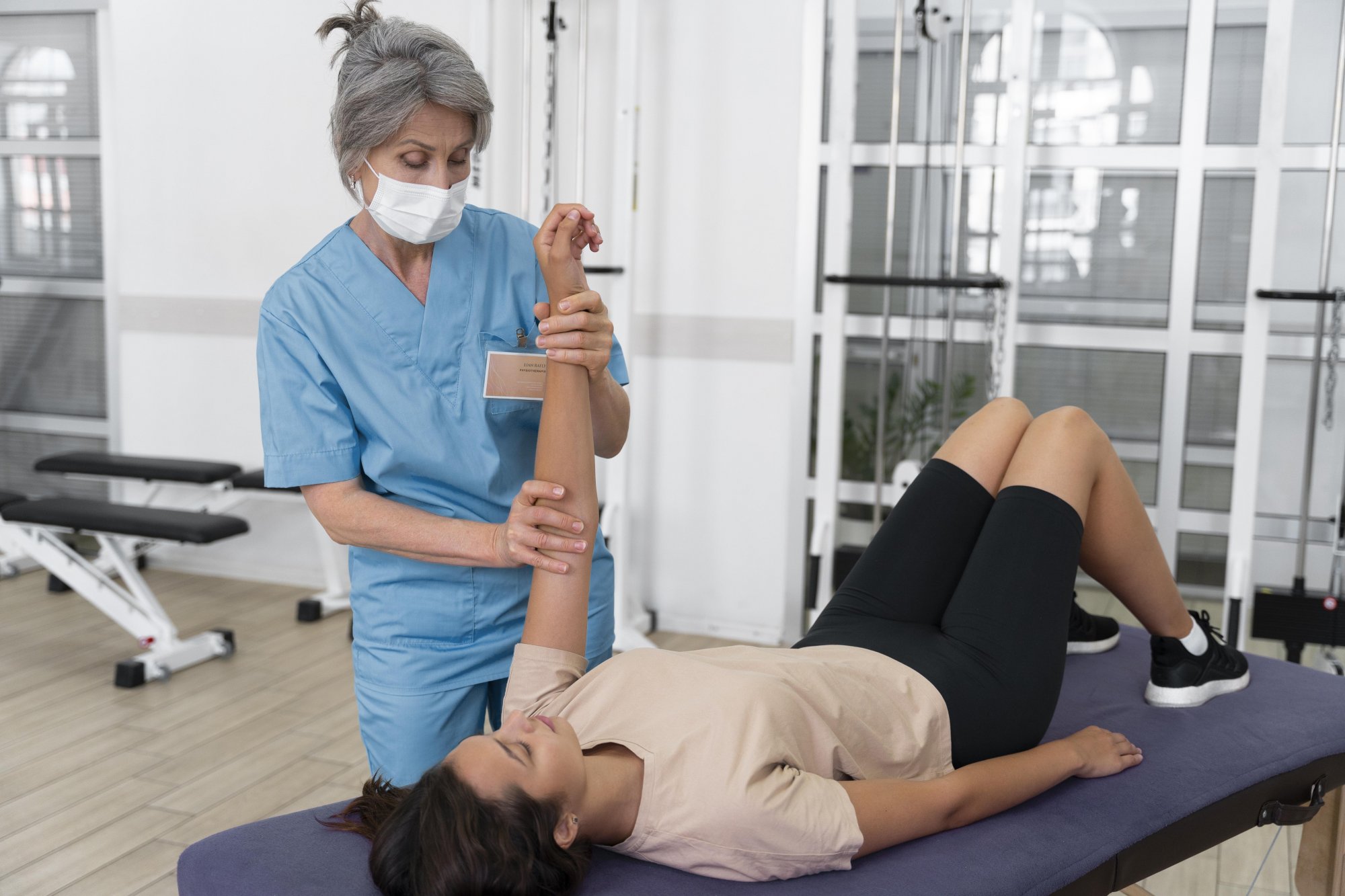 medical-assistant-helping-patient-with-physiotherapy-exercises